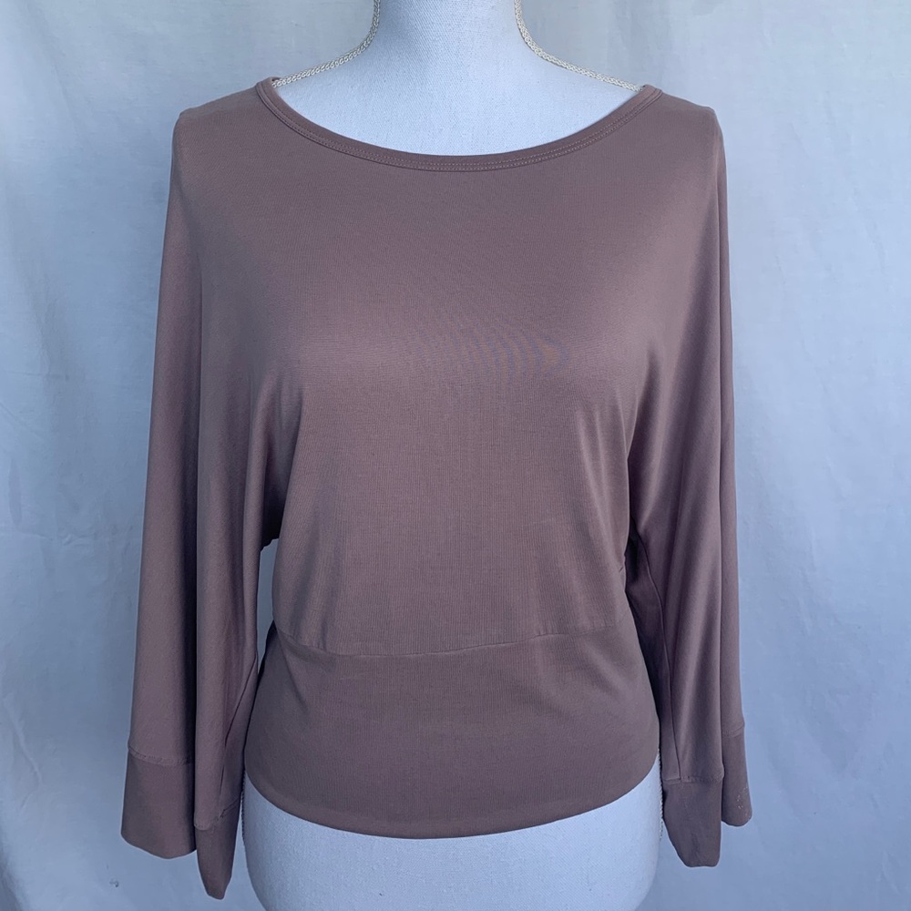 Anthropologie top with bell sleeves.